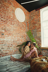 Image showing Couple of lovers at home relaxing together, comfortable