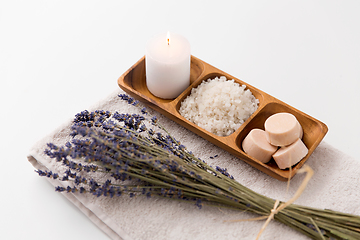 Image showing sea salt, soap, candle and lavender on bath towel