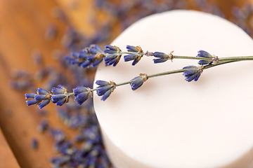 Image showing close up of crafted lavender soap on wooden tray