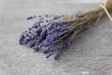Image showing bunch of dried lavender flowers on stone surface