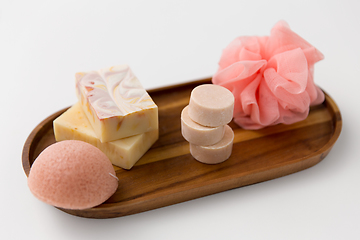 Image showing crafted soap, sponge and wisp on wooden tray