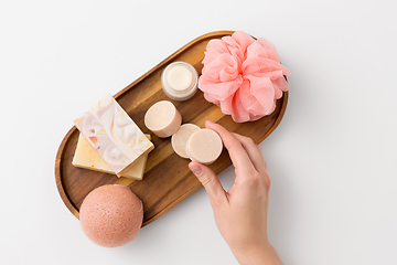 Image showing hand with soap, sponge, moisturizer and wisp