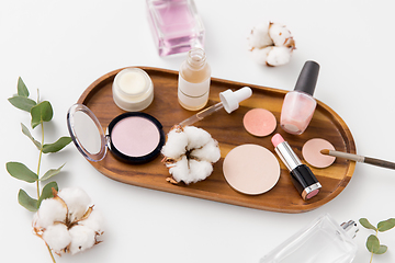 Image showing makeup, perfume and cosmetics on wooden tray