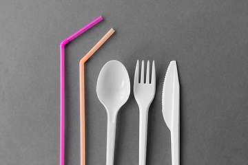 Image showing disposable plastic fork, knife, spoon and straws