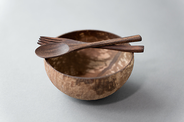 Image showing close up of coconut bowl, wooden spoon and fork