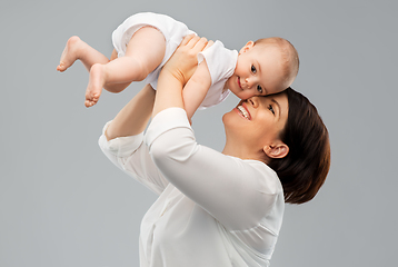 Image showing happy middle-aged mother with little baby daughter