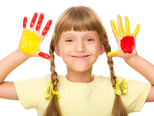 Image showing Portrait of a cute girl playing with paints