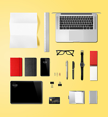 Image showing Office desk branding mockup top view isolated on yellow