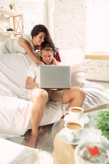 Image showing Couple of lovers at home relaxing together, comfortable