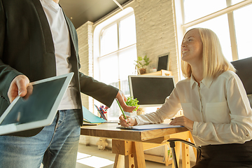 Image showing A young businesswoman moving in office, getting new work place