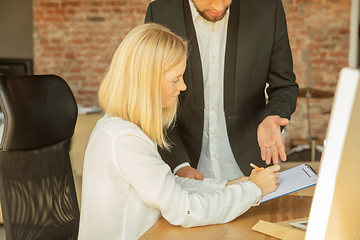 Image showing A young businesswoman moving in office, getting new work place