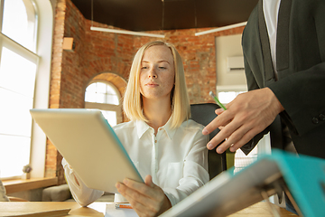 Image showing A young businesswoman moving in office, getting new work place