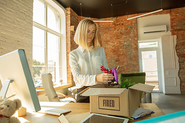 Image showing Young businesswoman fired, looks upset