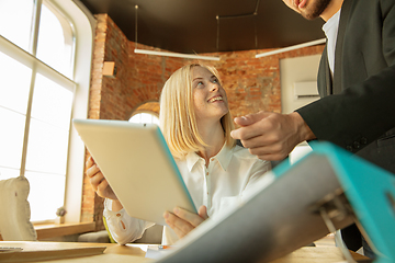 Image showing A young businesswoman moving in office, getting new work place