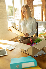 Image showing Young businesswoman fired, looks upset