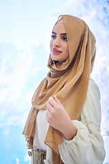 Image showing Girl wearing hijab posing on winter concept background