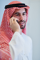 Image showing Portrait of young muslim businessman using mobile phone