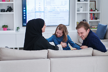 Image showing Happy Muslim family spending time together in modern home