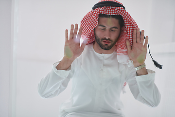 Image showing Muslim man doing sujud or sajdah on the glass floor