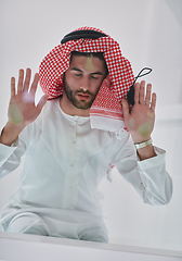 Image showing Muslim man doing sujud or sajdah on the glass floor