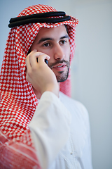 Image showing Portrait of young muslim businessman using mobile phone