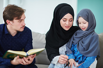 Image showing Young muslim family reading Quran during Ramadan