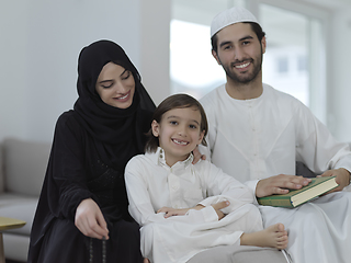 Image showing Young muslim family reading Quran during Ramadan