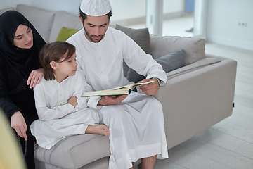 Image showing Young muslim family reading Quran during Ramadan