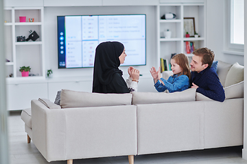 Image showing Happy Muslim family spending time together in modern home