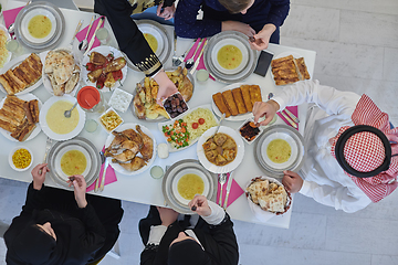 Image showing Top view of muslim family having Iftar during Ramadan holy month