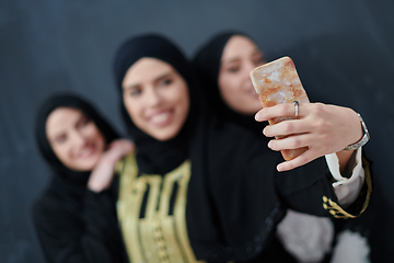 Image showing Portrait of Arab women wearing traditional clothes or abaya