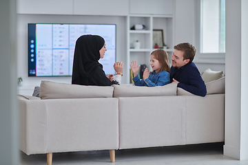 Image showing Happy Muslim family spending time together in modern home