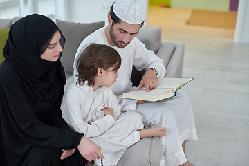 Image showing Young muslim family reading Quran during Ramadan