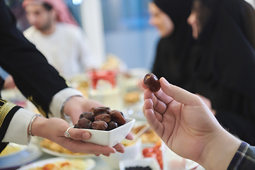 Image showing Muslim family starting iftar with dates during Ramadan