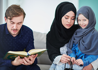 Image showing Young muslim family reading Quran during Ramadan