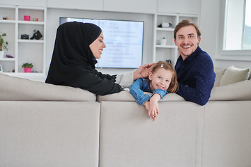 Image showing Happy Muslim family spending time together in modern home