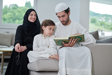 Image showing Young muslim family reading Quran during Ramadan