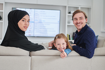 Image showing Happy Muslim family spending time together in modern home