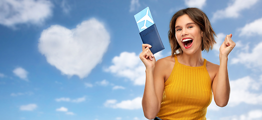 Image showing happy young woman with air ticket and passport