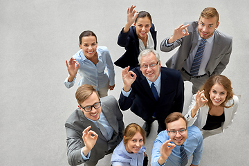 Image showing business people showing ok hand sign at office