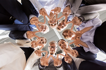 Image showing business people showing ok hand sign at office