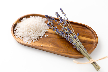 Image showing sea salt heap and lavender on wooden tray