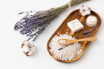 Image showing sea salt, lavender soap and moisturizer on tray