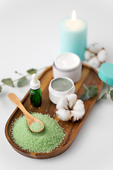 Image showing bath salt, serum, clay mask and cotton on tray