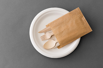 Image showing wooden spoon, fork and knife on paper plate