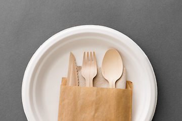 Image showing wooden spoon, fork and knife on paper plate