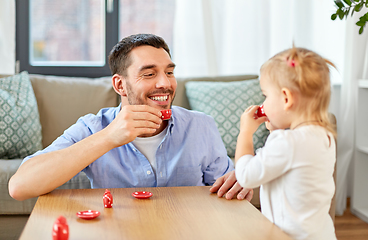 Image showing father and daughter playing tea party at home