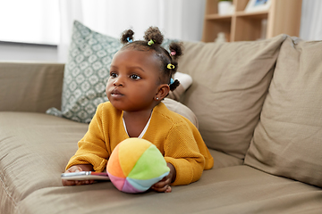 Image showing african american baby girl with smartphone at home