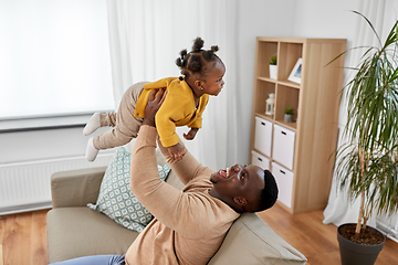 Image showing happy african american father with baby at home