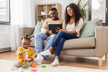 Image showing family with tablet pc and toy blocks at home